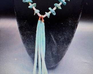 Pueblo Native American necklace features a mix of Natural blue Nevada turquoise tabs separated by fine brown shell heishi beads. Pictures do not do the jewelry justice. For more details go to: https://modestlambestatesales.hibid.com/