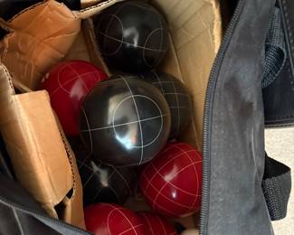 Bocce Balls in back with rule Book