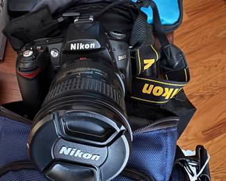 Cameras:  Olympus XA2 Electronic Flash, Minolta Autopak 500, Konica Auto Reflex 2 case 2 57mm Fl.4lens w case, Olympus Infinity Stylus Zoom 35mm, Bel & Howell Director Series Movie Camera w 2 reels Flm, Chinon Multi focus 3001 AF 35MM, Mikn D3300 18-55 VRII Kit w telephoto lens, NikonD90 w cables 18-105MM lens SD Cards & Case, Braun Hobby F 34 Flash, Vivitar Close-up Lens Set +1,2,3, Sylvania Sun Gun Movie Light, 1920's Camera-Bellows are intact, but fragile.Eyepiece can be turned to take portrait of landscape.