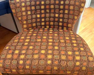 Could not find brand however this is Mid Century Style Chair. Original fabric