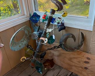 Metal work art. Could be a weather vane.  Not sure of the directions!