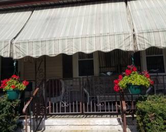 Awnings; wrought iron porch surround & double gate