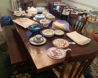 Dining table is shown with two leaves extended; includes two captain's chairs; two side chairs & a bench.