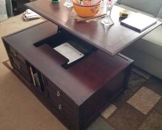 Coffee table by Magnussen converts to a desk