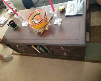 Coffee table by Magnussen converts to a desk