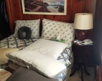 Queen bed; end table; table lamp