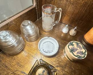 Beautiful vintage ashtrays (one reads "Hollywood"), glassware, mugs, and salt and pepper shakers.