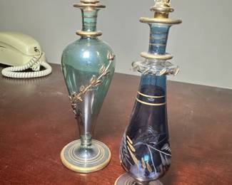 Two Egyptian hand-blown glass perfume bottles. 