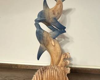 hand-carved wooden dolphin sculpture