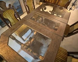 This MCM table has entertained some of the finest in the music industry. It can be made smaller (the middle glass section can be removed). It is on casters and has 6 beautiful chairs with a unique velvet pattern.