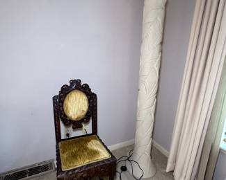 Antique wood carved side chair and ceramic floor lamp