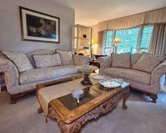 Beautiful wooden coffee table, rolled arm sofa, and rolled arm loveseat. Together, they would add a beautifully elegant touch to your living room!