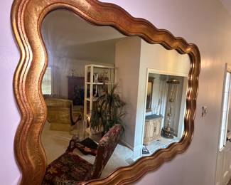 Gold leaf wall mirror with scalloped edges