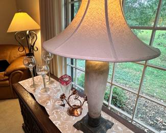 vintage-style table lamp with a fabric shade and a decorative base