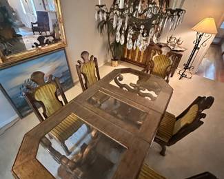 This MCM table has entertained some of the finest in the music industry. It can be made smaller (the middle glass section can be removed). It is on casters and has 6 beautiful chairs with a unique velvet pattern.
