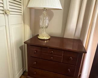 Wooden night stand and a glass table lamp with shade