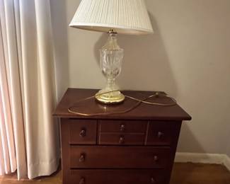 Wooden night stand and a glass table lamp with shade