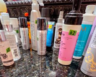 Many unused (and used) hair gels, curl cream, shampoo/conditioner, oil, frizz eaze, and more!