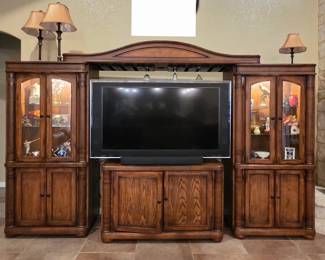 4 pieces total. 2 curio cabinet/storage pieces, 1 Entertainment center & 1 bar top. Can be used as seen or separately but sold as q.