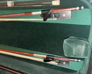 One full-size pernambuco violin bow. The stick is round, and the ebony frog has sterling silver mounts.