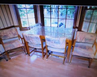 VINTAGE GLASS TOP DINING TABLE WITH 6 ROLLING CHAIRS