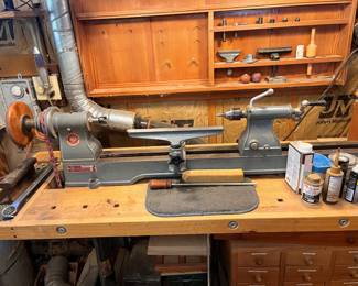 Vintage Delta Lathe with live tail center. Features 11" swing and 48" capacity with extras.