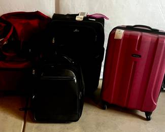  Red Hard Shell Rolling Suitcase with Black Soft Luggage and Carry Bags