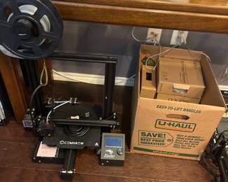 3D printer with extra rolls of filament 