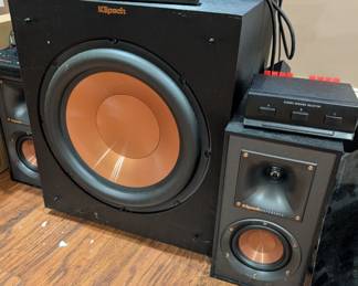 Klipsch R-12SW Powered Subwoofer, along with other Klipsch speakers and a stereo speaker