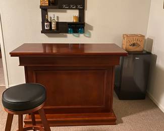 bar with matching stool, wall custom hand made wine rack, small refrigerate 