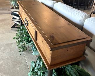 Behind couch console table.