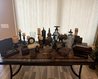 Various sets of candle sticks and decorative items.