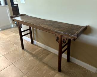 Console table made out of unique wood and workmanship.