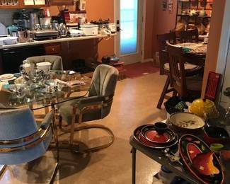 Kitchenware, small appliances, microwave, dishes pots and pans, silverware, and more.