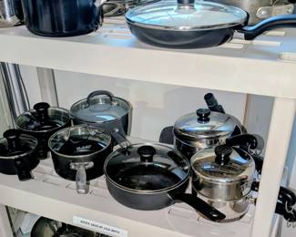 Many pots and pans including calphalon.