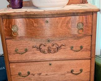 Antique tiger oak five drawer dresser with mirror.