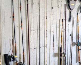 Many fishing rods with reels.