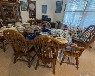 Large dining room table with six chairs. Two leaves, great condition.
