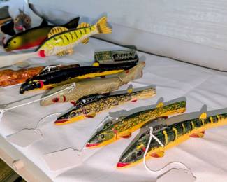 Carved fish decoys.