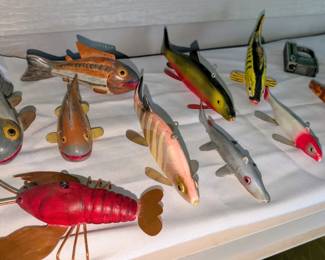 Carved fish decoys.
