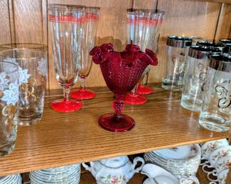 Many pieces of vintage glassware.