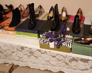 Three tables full of shoes