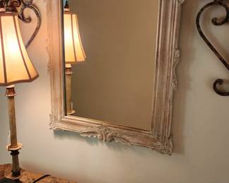 Hall/console table pictured with beautiful, beveled glass mirror and wall sconces