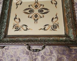 Heavy mirrored tray with brass handles. Can be used for serving or art piece