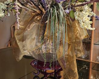 Gorgeous arrangement on stand pictured on the Henredon dining table