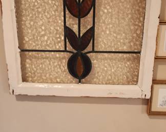 Leaded stained glass window in wooden frame