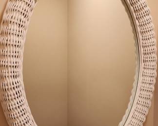 One of 2 large oval wicker mirrors