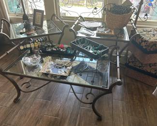 Wrought Iron glass end table and 2 side tables. Frames, jewelry, cushioned seats, candles, and watches. 