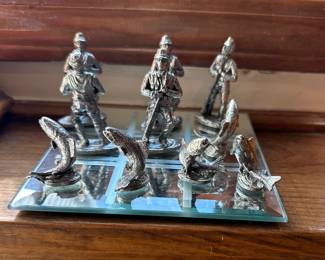 Pewter soldiers and fish figurines 
