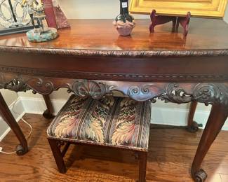 Detail on the carving on the table - hidden drawer on the front